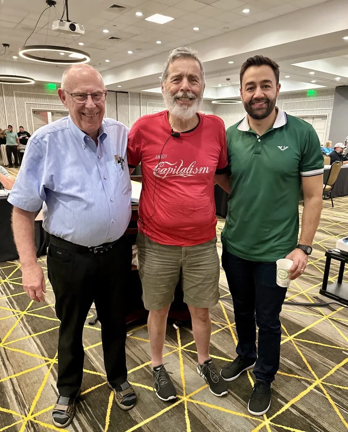Darryl McCullough, Pete Fortunato, and Alejandro Duque standing together in a conference room