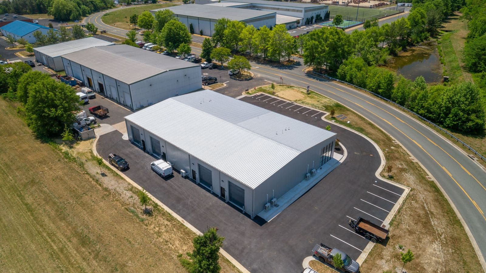 Aerial view of the finished Shannon Park building and striped parking lot