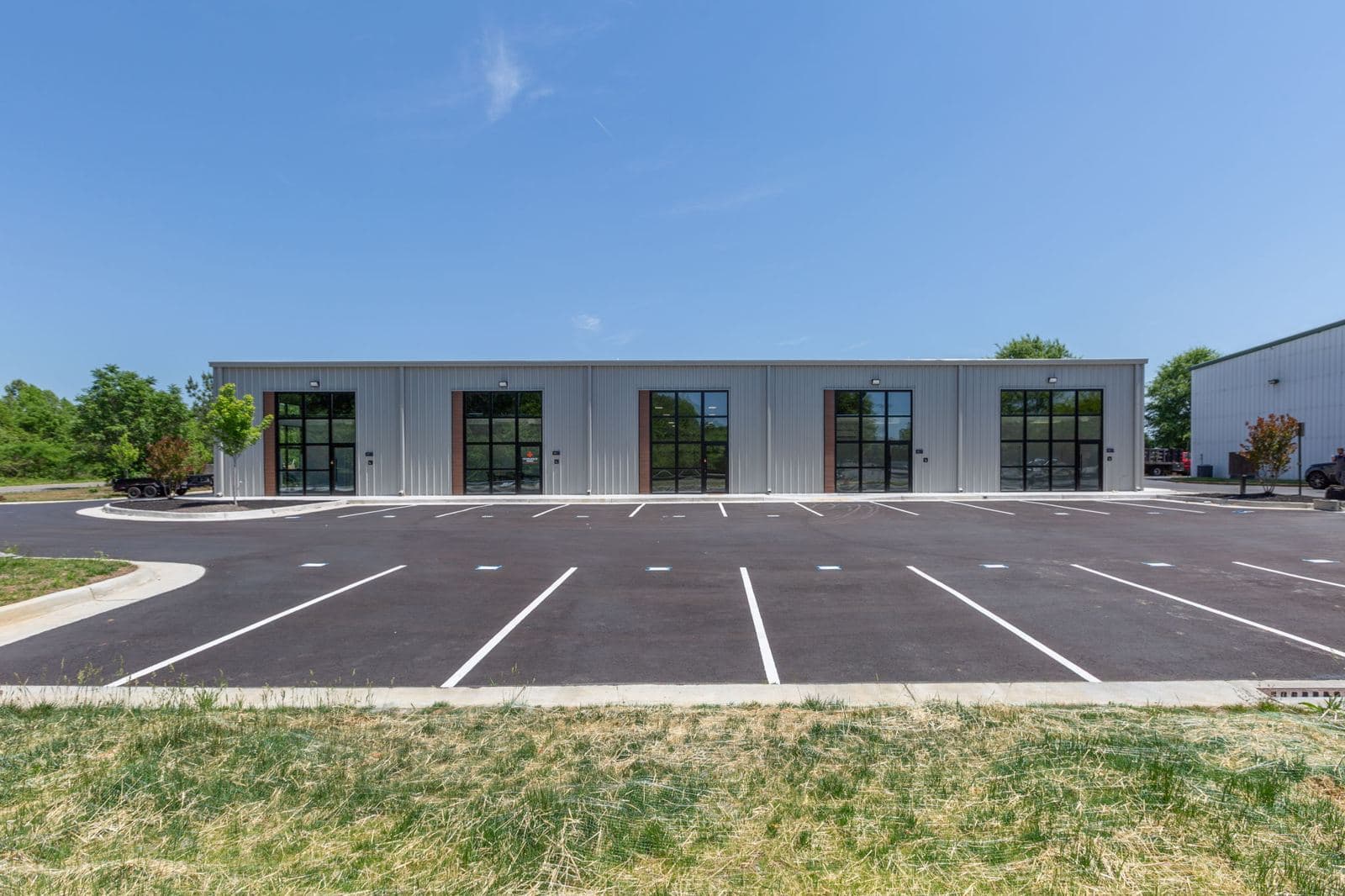 Front elevation of the finished Shannon Park light industrial building with glass storefronts